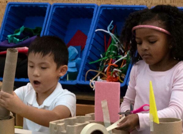 Two Elisabeth Morrow School students making Earth Day crafts.