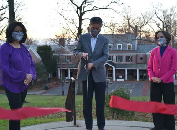 Maureen Fonseca, Head of school at Elisabeth Morrow School, with EMS parents Frank and Jean Zhang cutting the ribbon for EMS school improvements.