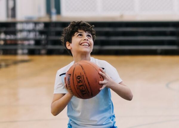 A Morrow House Students Shoots a Basketball in the Gym at The Elisabeth Morrow School