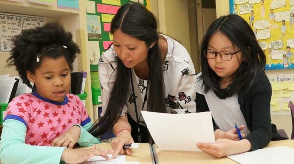 Two Little School students at Elisabeth Morrow School study with their teacher