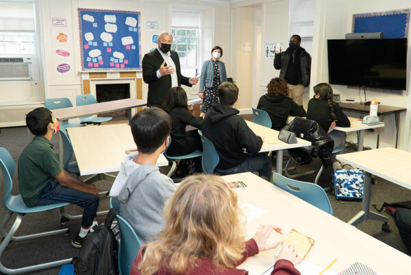 While on tour at The Elisabeth Morrow School in Englewood, NJ, City of Englewood’s Mayor Michael Wildes (standing left) paused to speak with a seventh-grade English class about his love of reading and related community service opportunities.