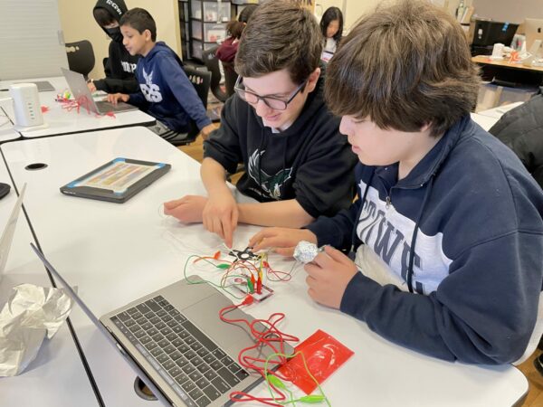 Students working with Makey Makey kits