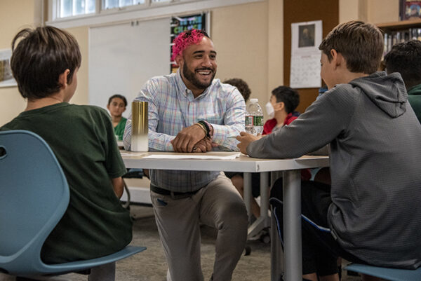 Teacher talking with students.