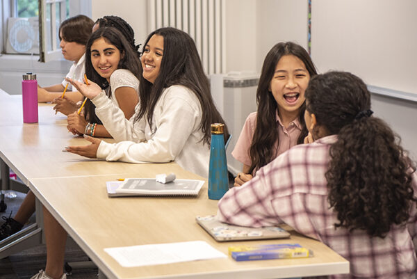 Morrow House students smiling during class. slider