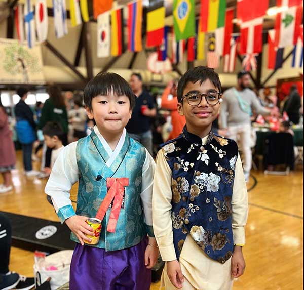 Two friends enjoying the International Food Festival