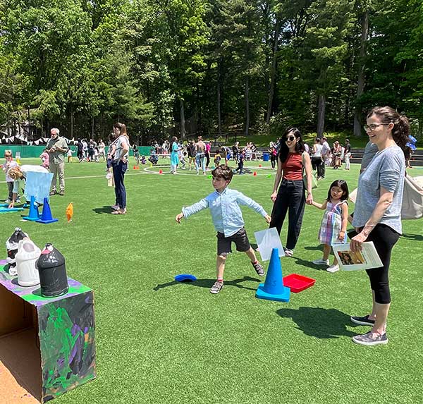 Students playing games at the Mary Hawkins Fair