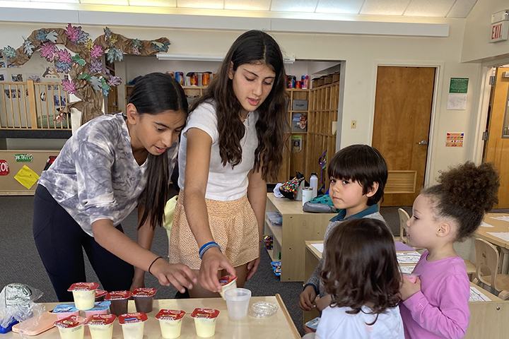 Morrow House students helping Chilton House students with a cooking class.