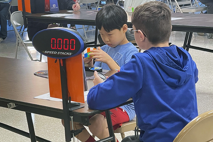 Students participating in a cubing competition.