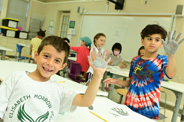 Students showing painted hands