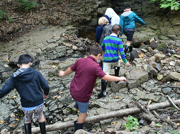 Little School students exploring our creek on campus.