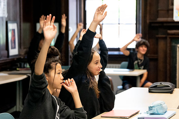 Morrow House students raising their hands