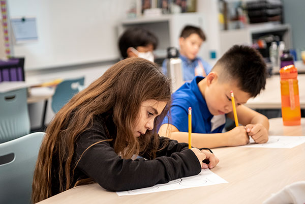 Two Morrow House students working during class