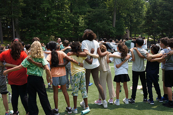 Students linked together during all-school assembly