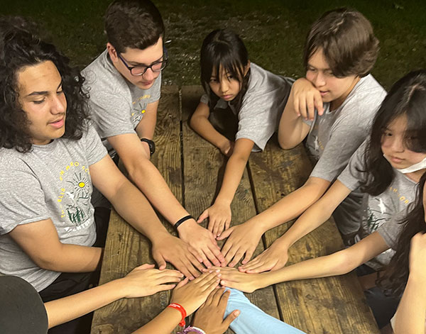 Morrow House students putting their hands together during Adventure Week