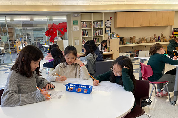 Little School students working on math problems during Continental Math League.