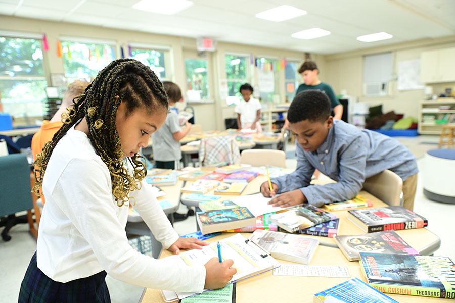 Our lower school students in Little School browse a book selection to find books they would like to read and discuss this school year.