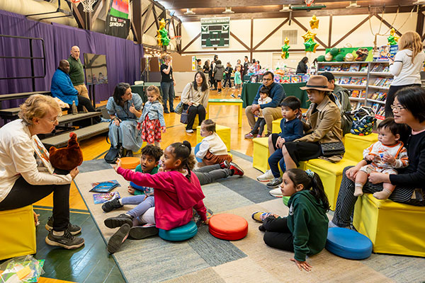 Special visitor reading to children and families at our Book Fair & Storytelling Festival.