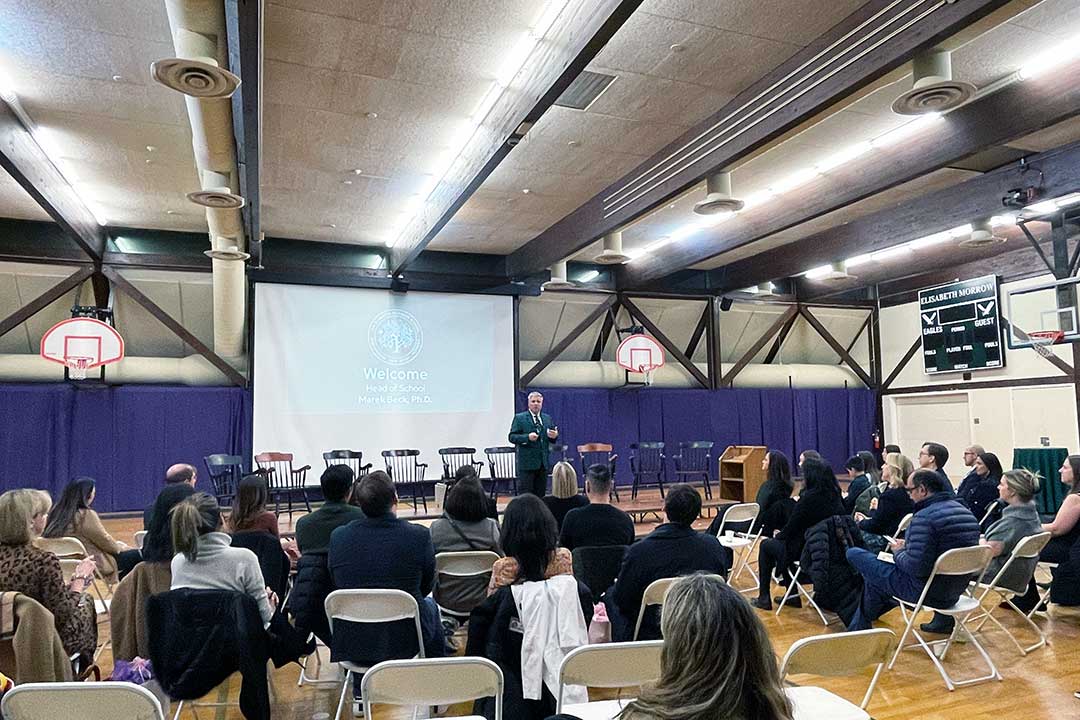 A photo of Head of School Marek Beck at the podium at last year's State of the School, 2023.