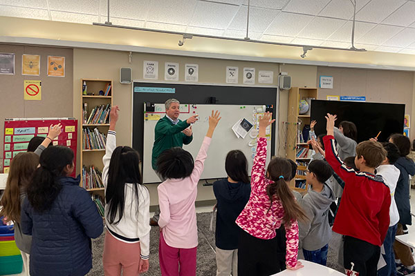 Head of School Dr. Marek Beck working with students during Continental Math League