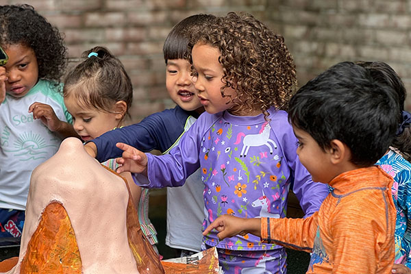 Our youngest students examining a working volcano project during Summer Explorations