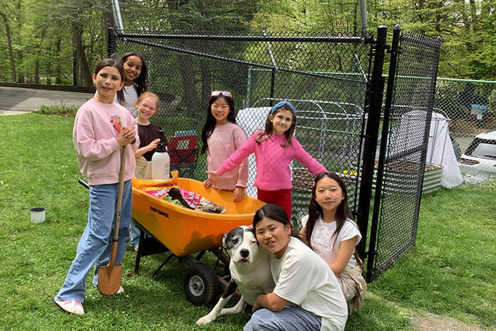 EMS students standing outside the Little Farm.